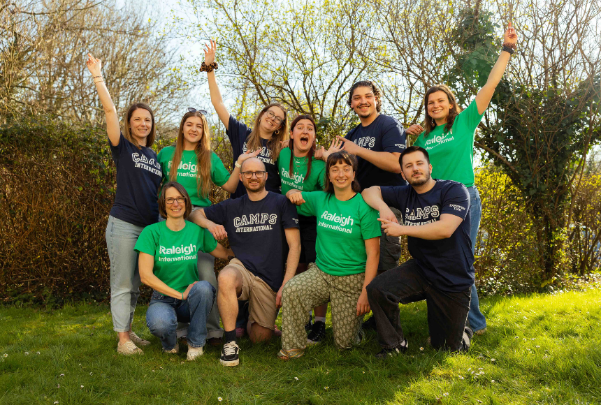 Employees from Camps International and Raleigh International came to celebrate partnership wearing their respective blue and green branded t-shirts