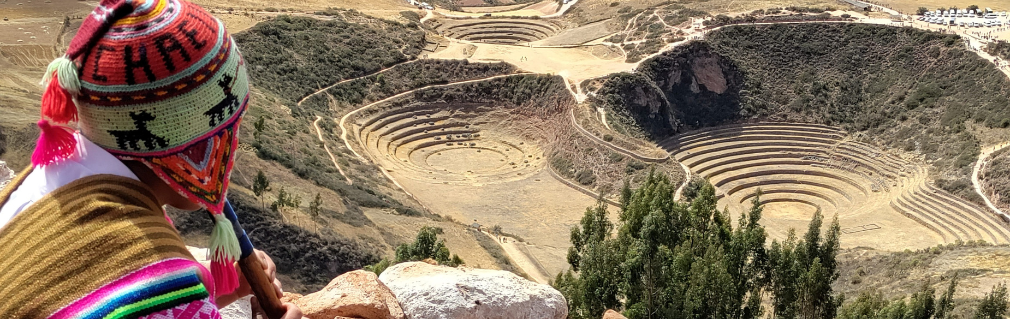 Reflections and Flute playing in Peru overlooking the Moray archaeological site