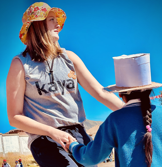 Showcasing culture immersion with participant and community member in Peru on a Kaya Responsible Travel Programme.