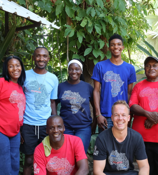 African Impact in Zambia wearing colourful t-shirts with the map of Africa