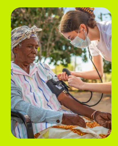 Pre Medical student taking blood pressure in Zambian community.
